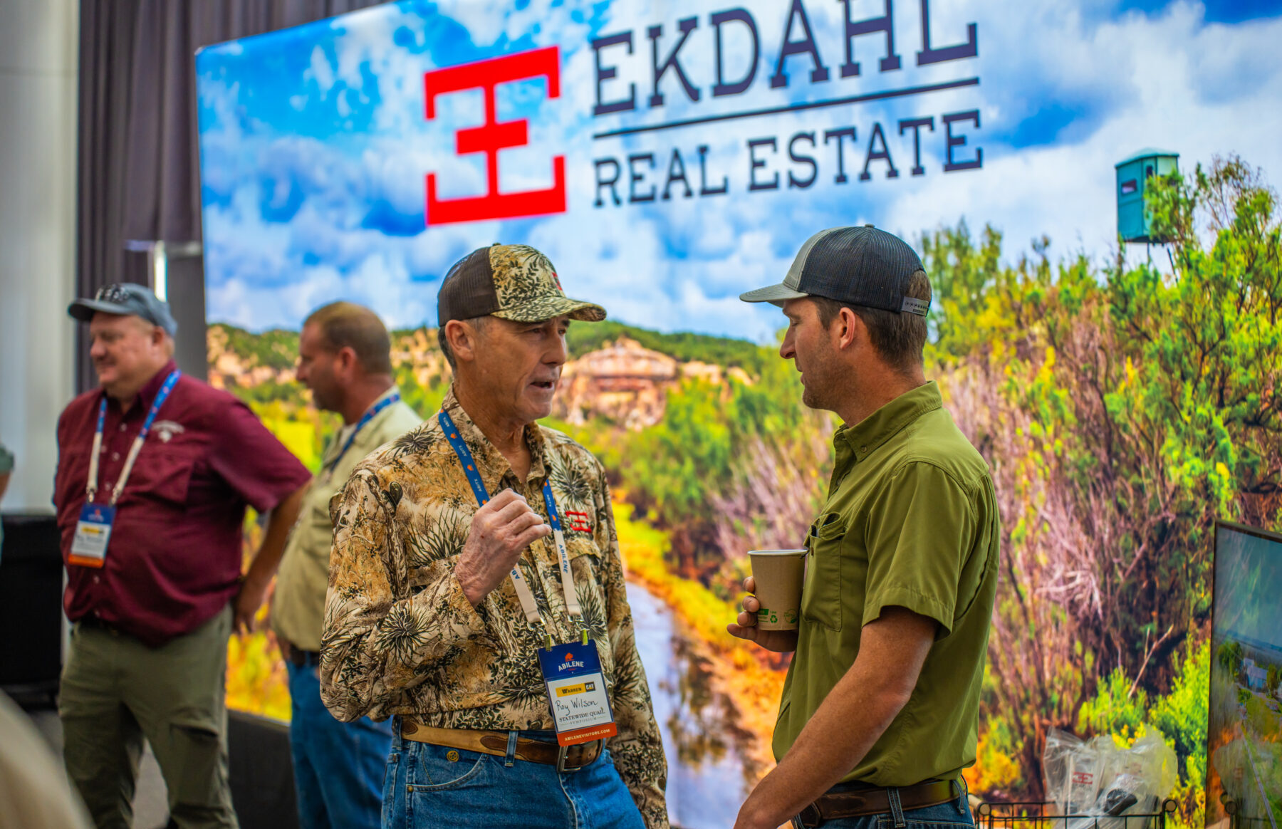 Ekdahl agent talking with a client at an event.