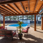 Summer home with a patio, pool and seating area